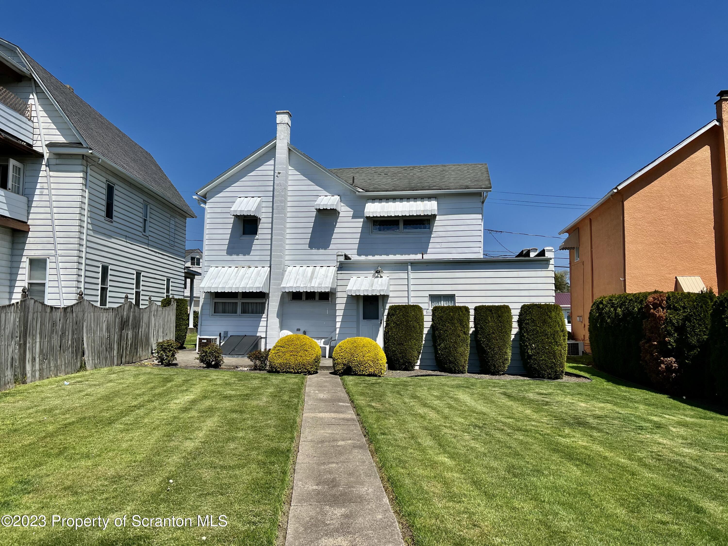 204 Moosic Road Old Forge, PA 18518 - Photo 4 of 31 a front view of a house with a yard