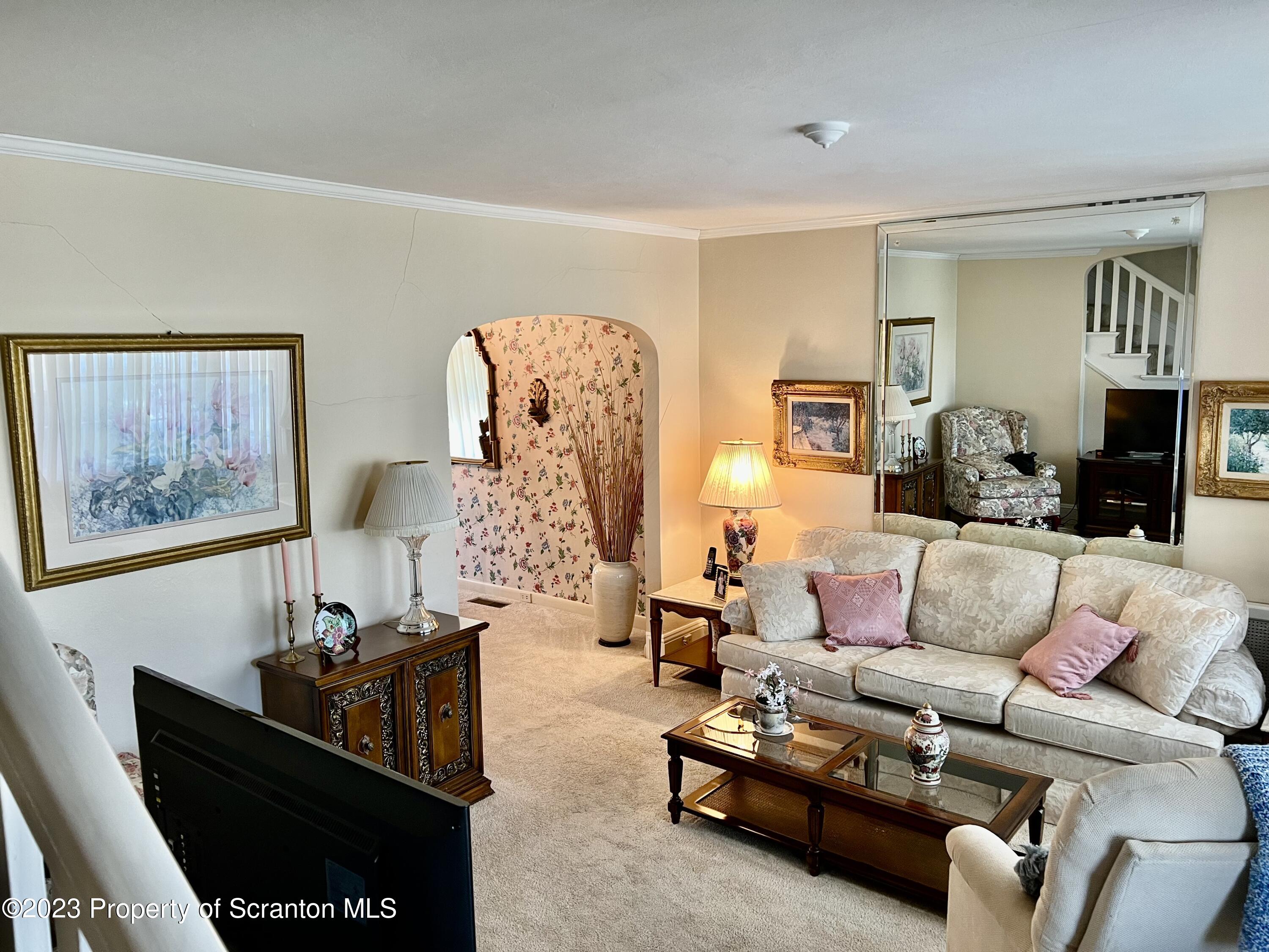 204 Moosic Road Old Forge, PA 18518 - Photo 5 of 31 a living room with furniture and a lamp