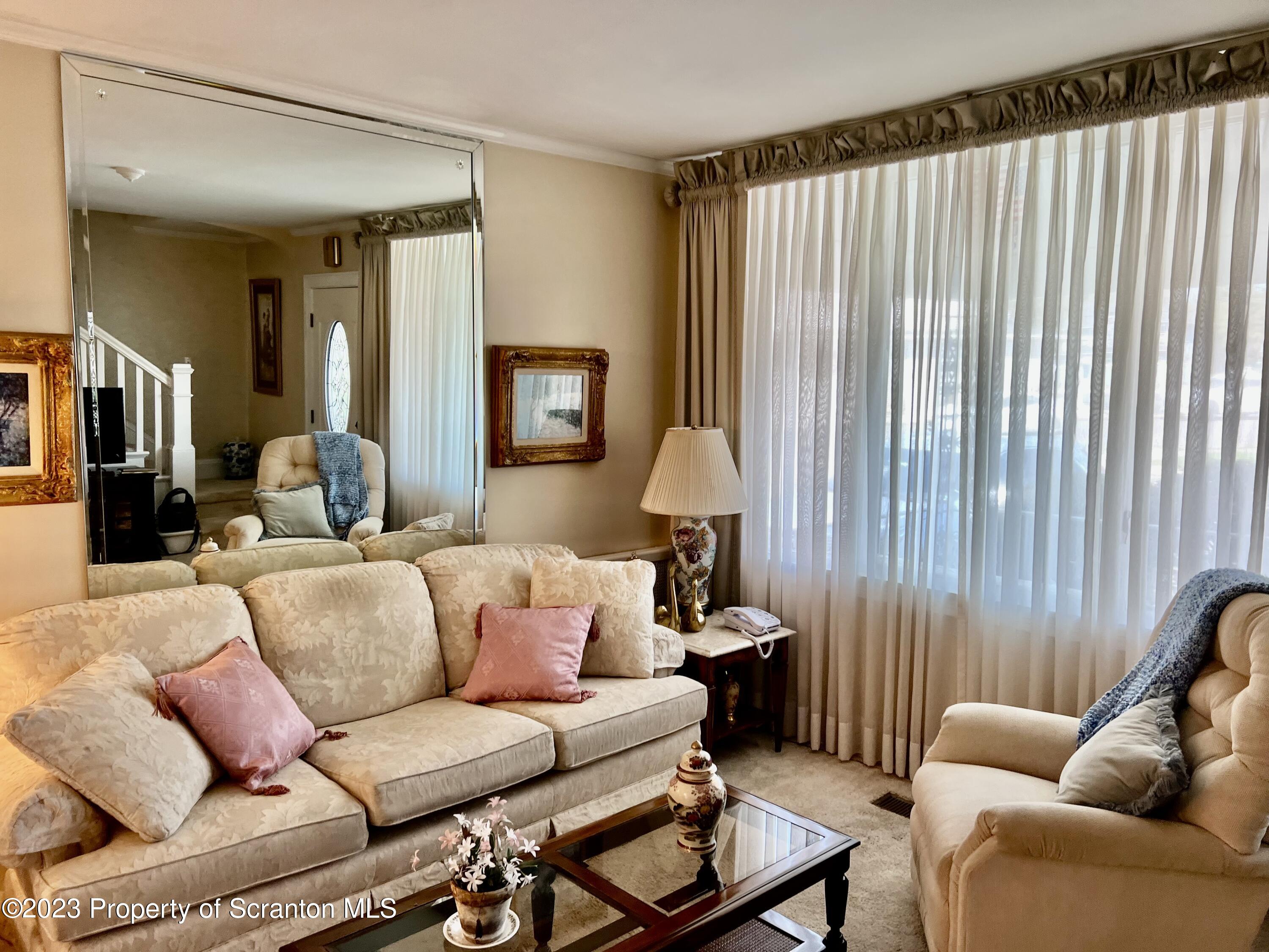 204 Moosic Road Old Forge, PA 18518 - Photo 7 of 31 a living room with furniture and a lamp