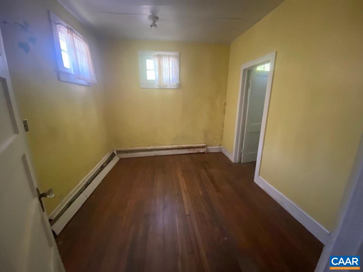 5367 James Madison Highway Fork Union, VA 23055 - Photo 7 of 11 a view of a room with wooden floor and windows