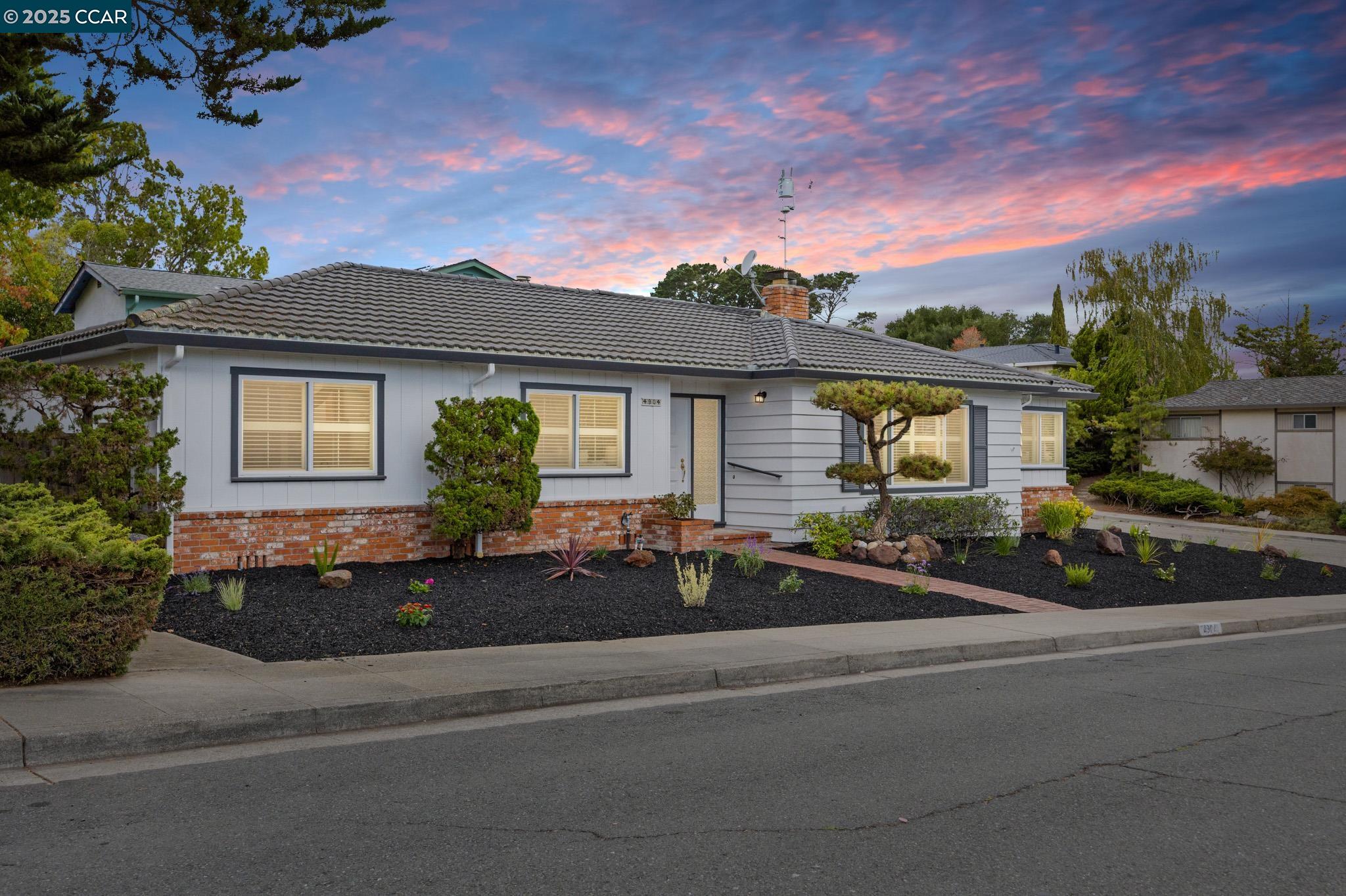 a front view of a house with garage