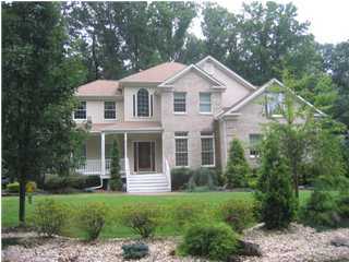 28 Muhlenbrink Road Colts Neck, NJ 07722 - Photo 1 of 3 a front view of a house with a yard