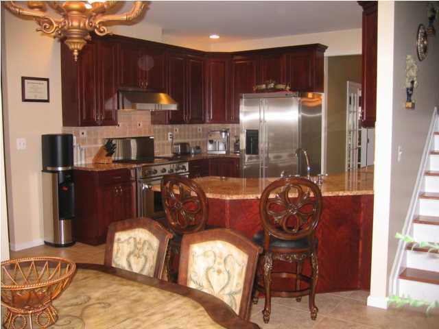 28 Muhlenbrink Road Colts Neck, NJ 07722 - Photo 2 of 3 a kitchen with granite countertop a wooden cabinets and a sink