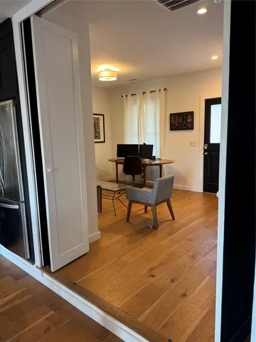 a workspace with furniture and a window