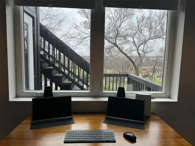 a living room with large windows