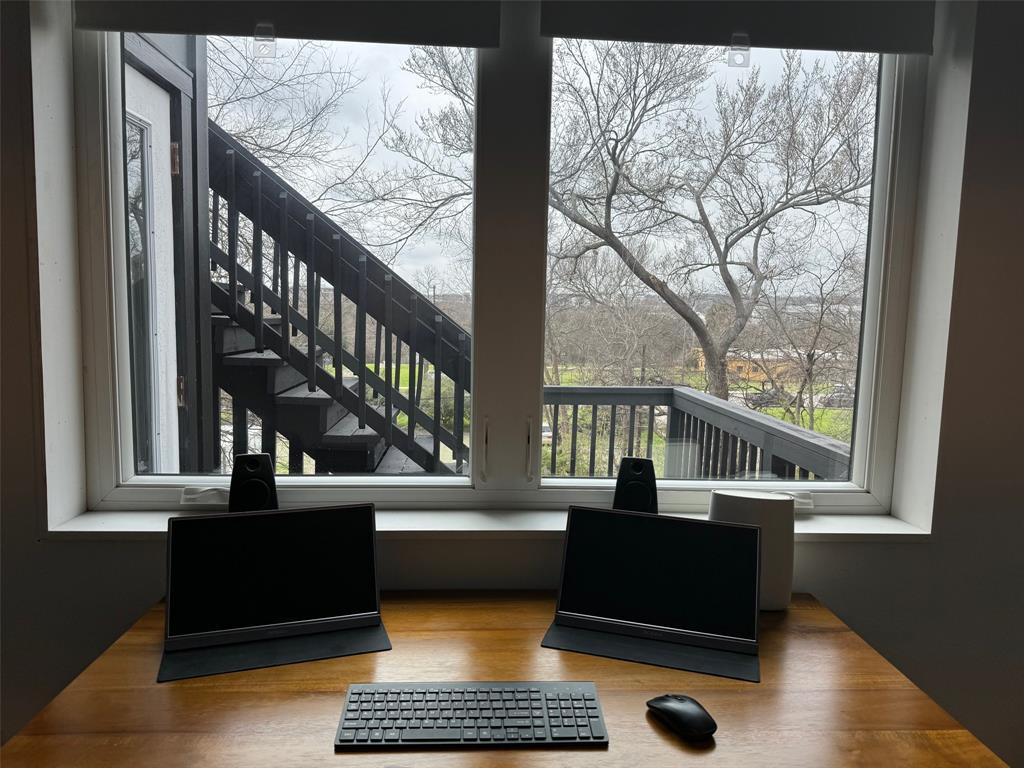 2109 Riverview Street, Unit A Austin, TX 78702 - Photo 19 of 32 a living room with large windows