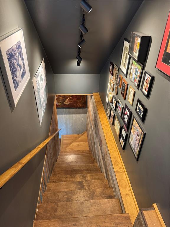 2109 Riverview Street, Unit A Austin, TX 78702 - Photo 23 of 32 a hallway with wooden floor and stairs