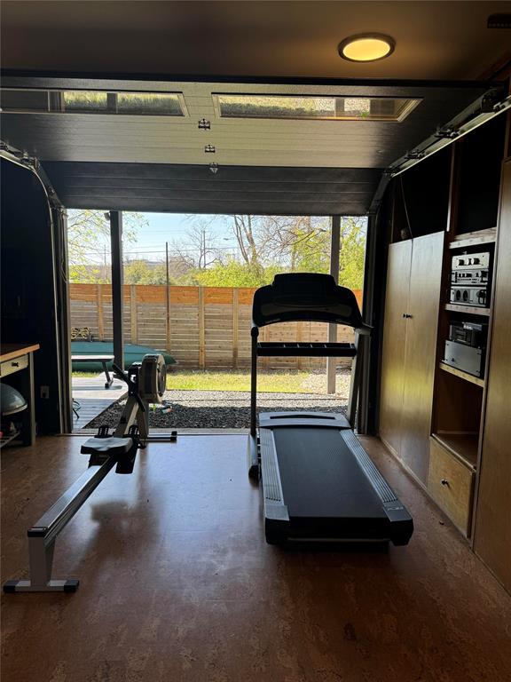 2109 Riverview Street, Unit A Austin, TX 78702 - Photo 31 of 32 a room with gym equipment and large window
