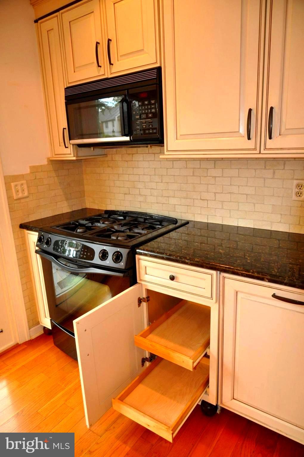 8428 Willow Forge Road Springfield, VA 22152 - Photo 16 of 44 Gas cooking and pull out storage for pots and pans