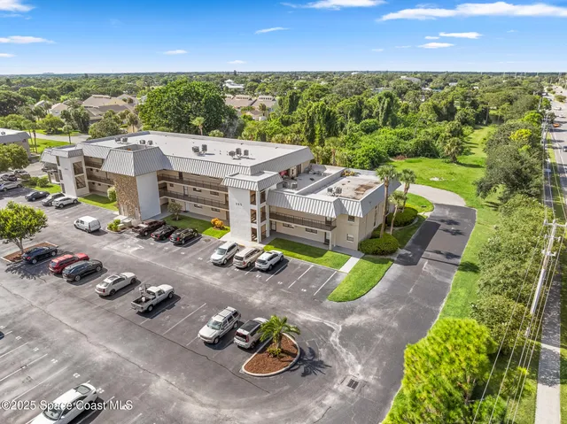an aerial view of a house with a garden