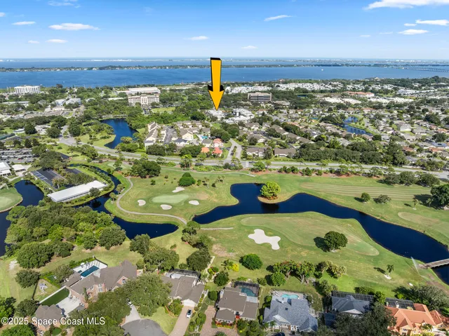 a view of a house with a yard and garden