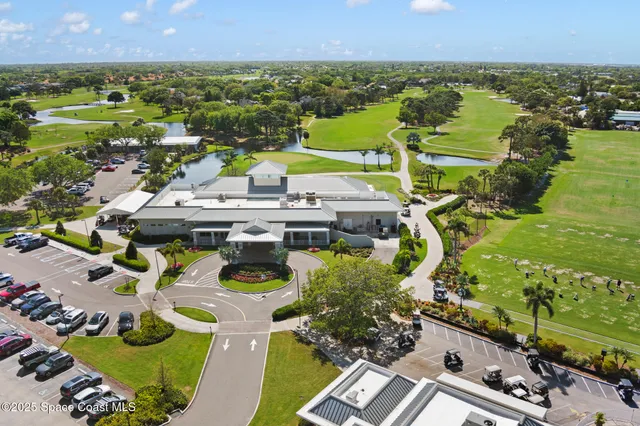 an aerial view of a house with a ocean view