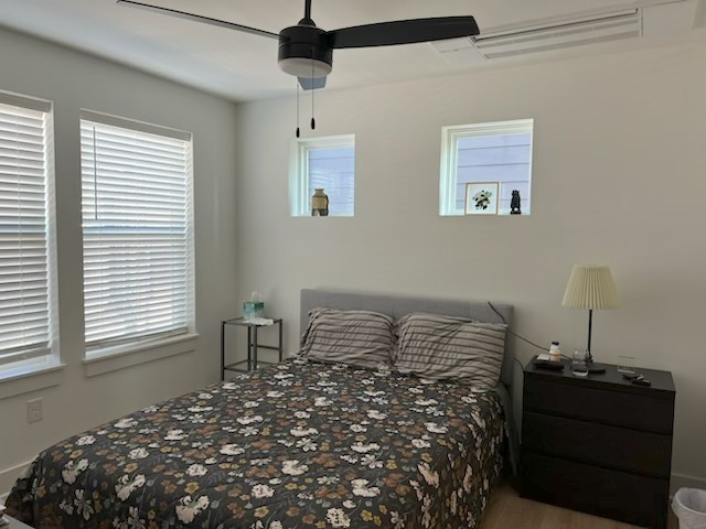 102 Duke Street, Unit 33 Nashville, TN 37207 - Photo 6 of 15 a bed sitting in a bedroom next to a window