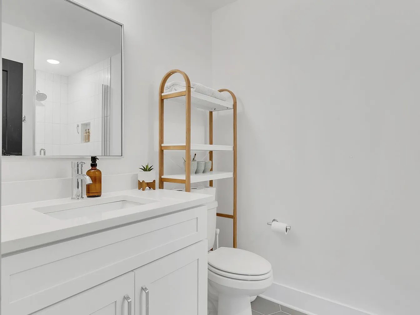102 Duke Street, Unit 33 Nashville, TN 37207 - Photo 9 of 15 a bathroom with a sink a toilet and a mirror