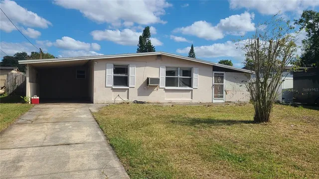 a view of a backyard of the house