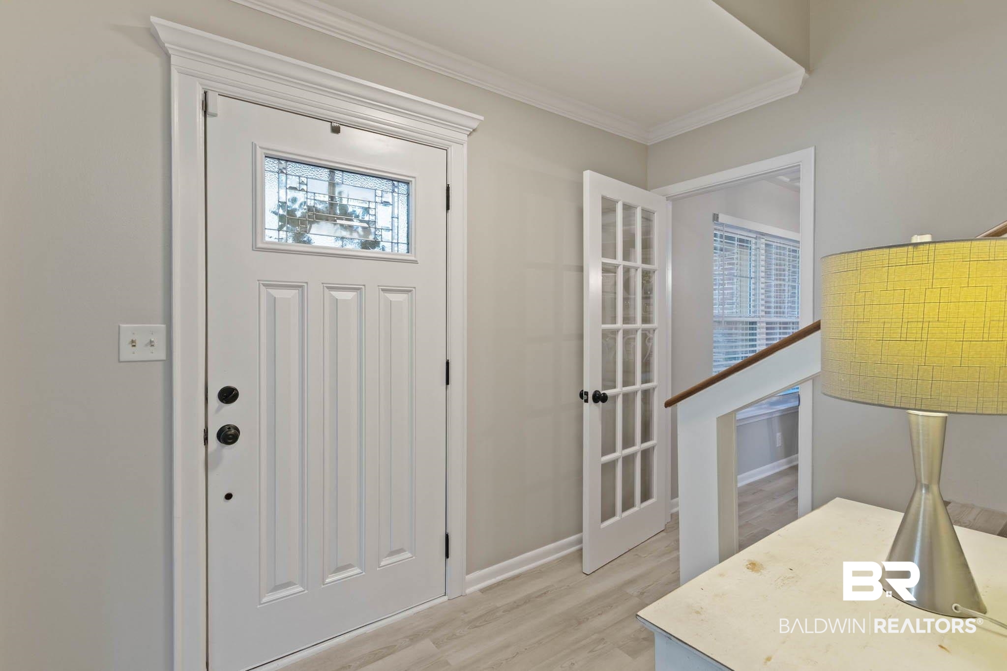 608 Southern Way Daphne, AL 36527 - Photo 3 of 35 Foyer entrance featuring healthy amount of natural light, light wood-type flooring, and ornamental molding