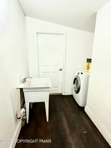 a bathroom with a bathtub and toilet
