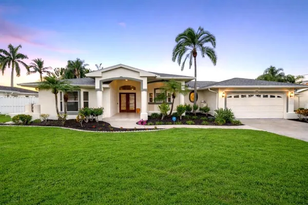 a front view of a house with a yard