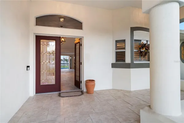 a view of a livingroom with furniture and a ceiling fan