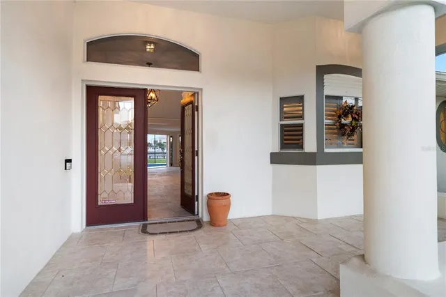 a view of a hallway with wooden floor and entryway