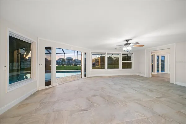 a view of a livingroom with a furniture and chandelier fan