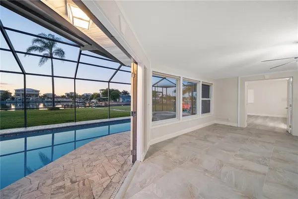a view of a room with window and a ceiling fan