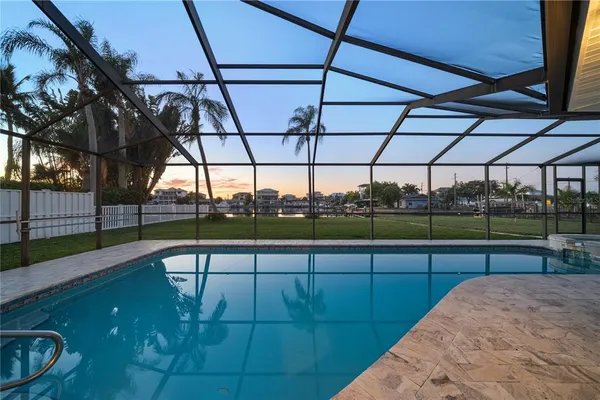 a view of a swimming pool with a porch