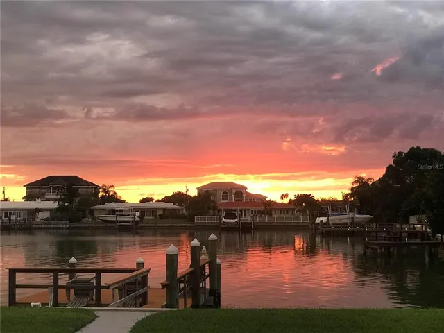 an aerial view of residential house with outdoor space and lake view