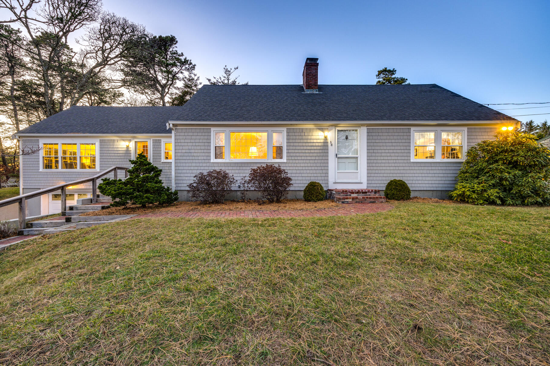 a front view of a house with a yard