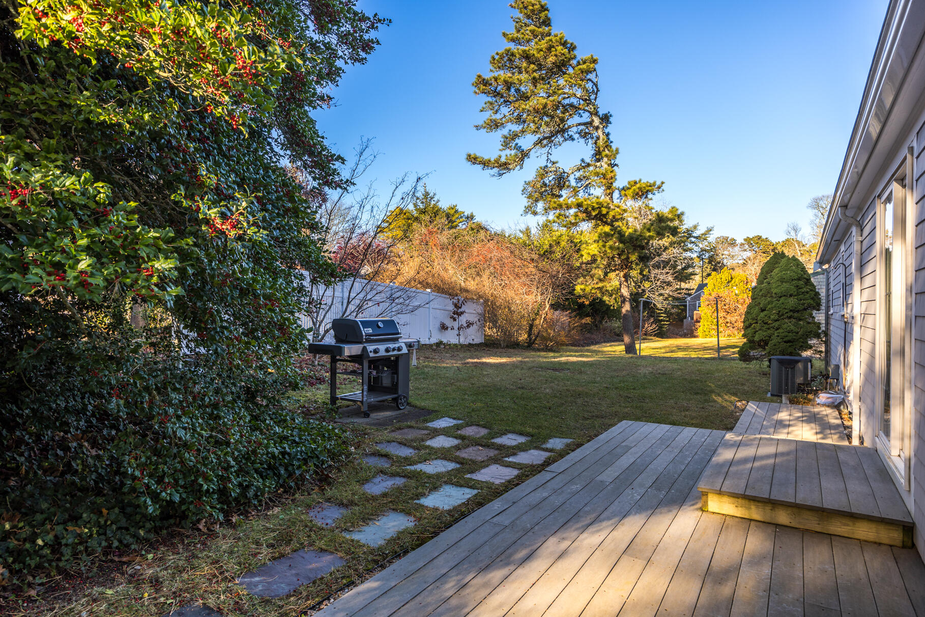 38 Rainbow Way Harwich, MA 02645 - Photo 17 of 50 a view of a yard with plants and large trees