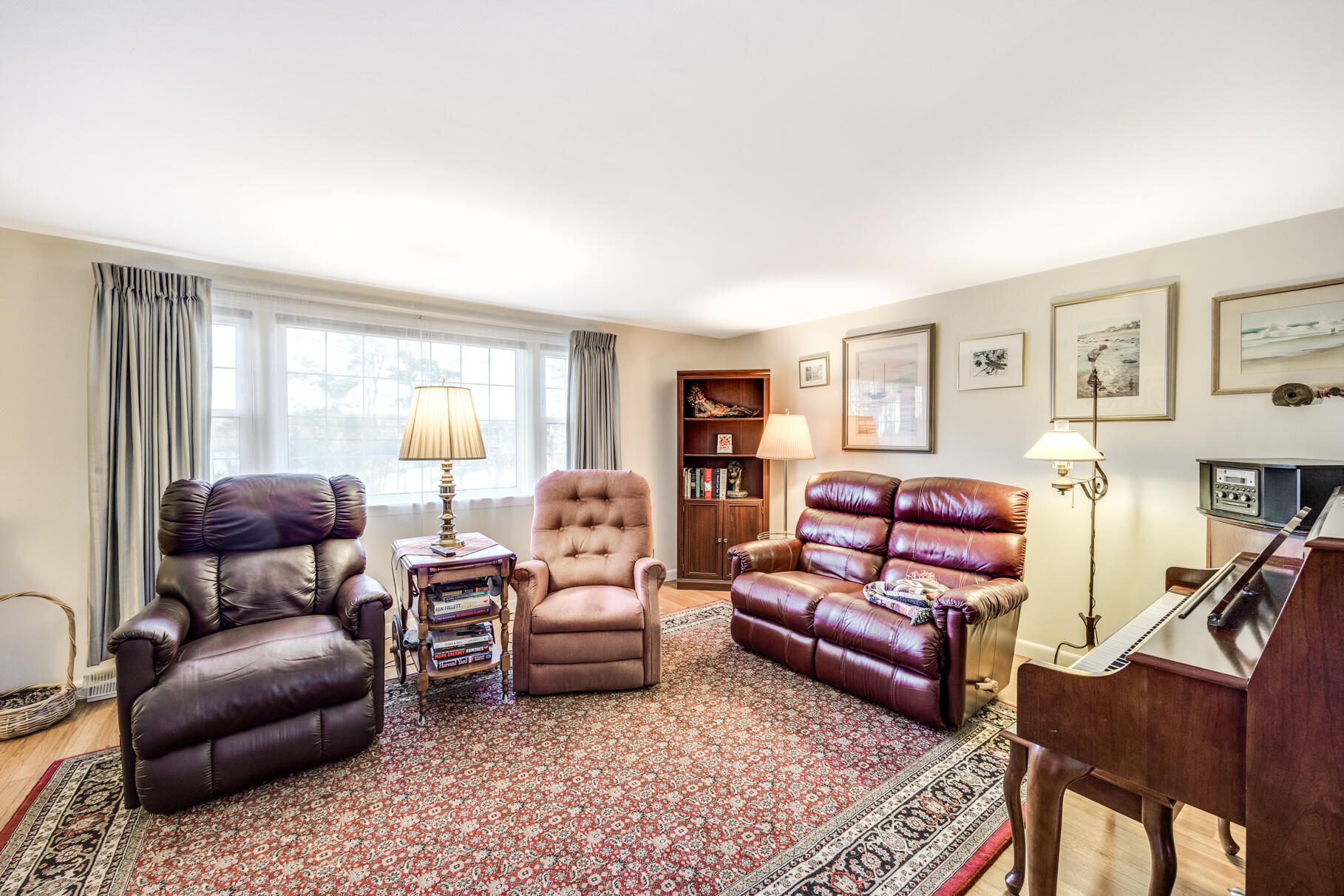 38 Rainbow Way Harwich, MA 02645 - Photo 20 of 50 a living room with furniture a rug and a large window
