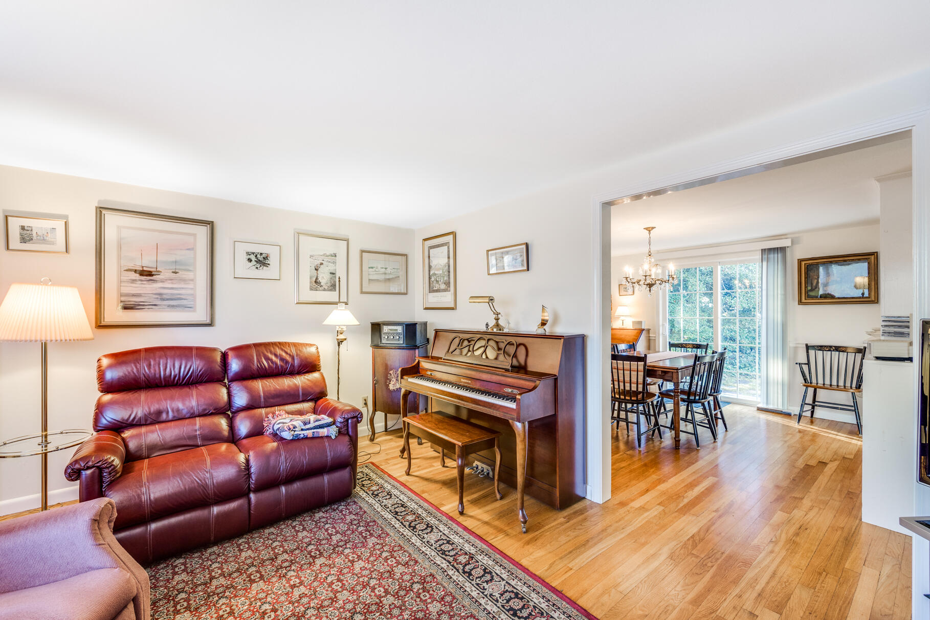 38 Rainbow Way Harwich, MA 02645 - Photo 21 of 50 a living room with furniture a wooden floor and next to a window