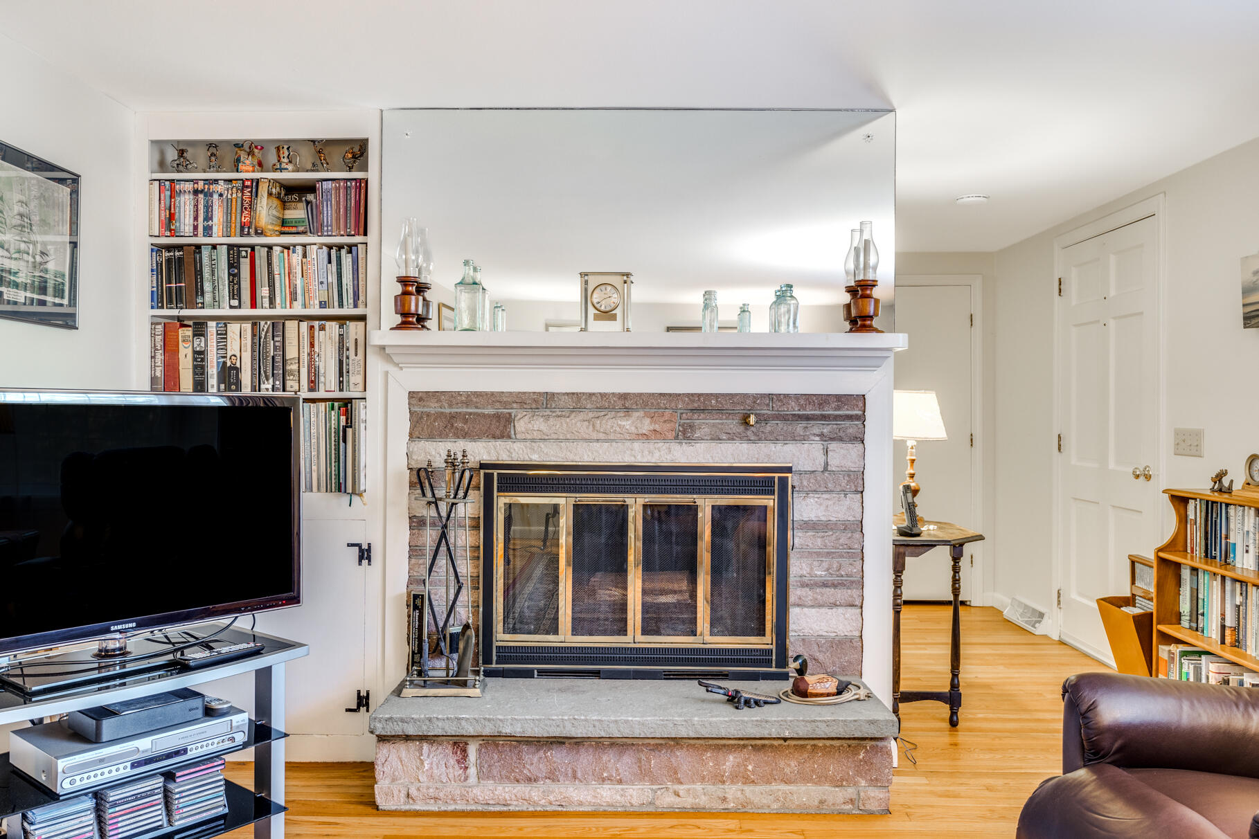38 Rainbow Way Harwich, MA 02645 - Photo 23 of 50 a living room with fireplace furniture and a flat screen tv