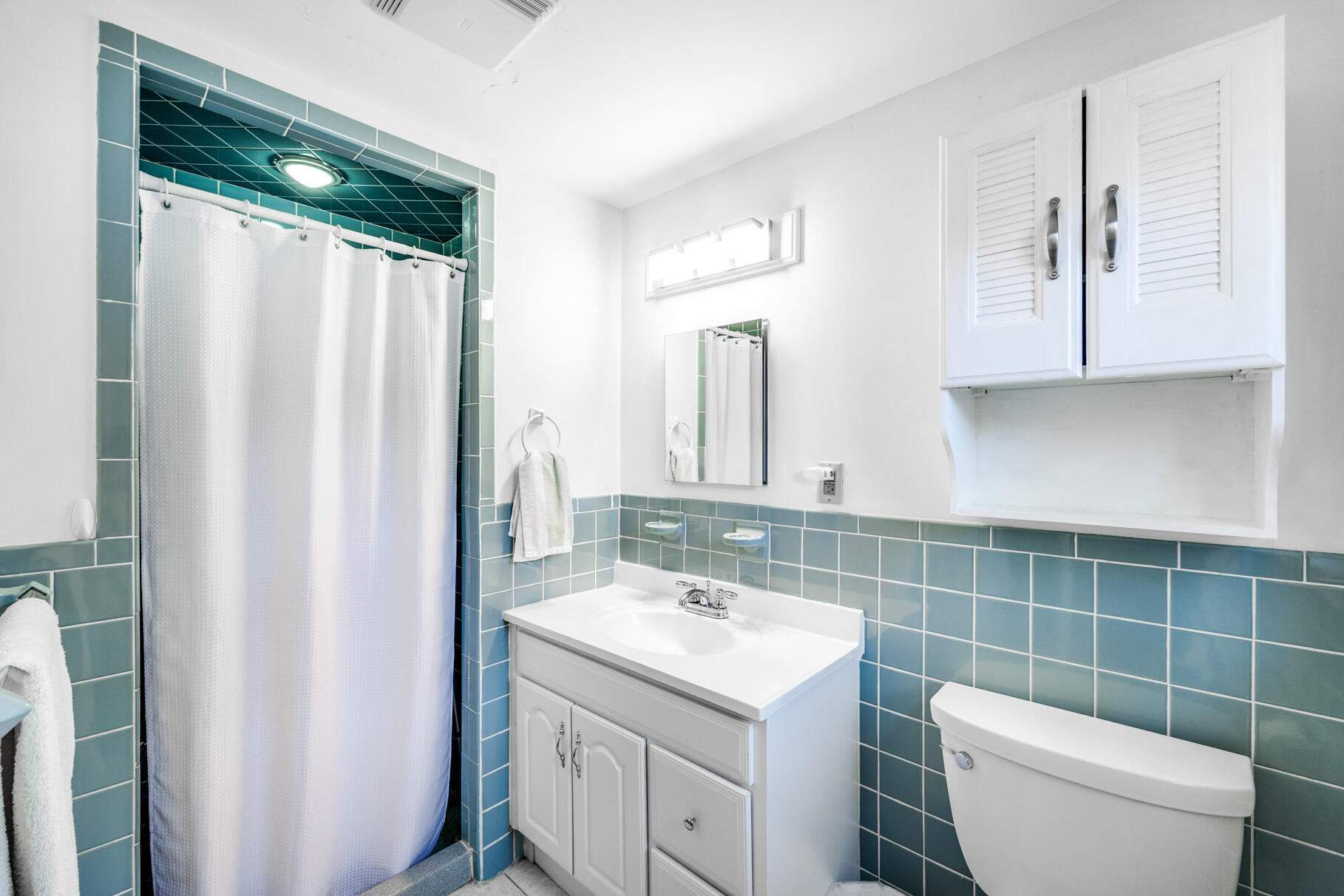 38 Rainbow Way Harwich, MA 02645 - Photo 27 of 50 a bathroom with a toilet sink and mirror