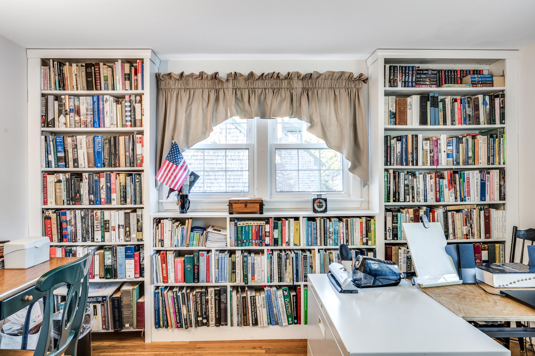 38 Rainbow Way Harwich, MA 02645 - Photo 30 of 50 a living room with a book shelf and a book shelf