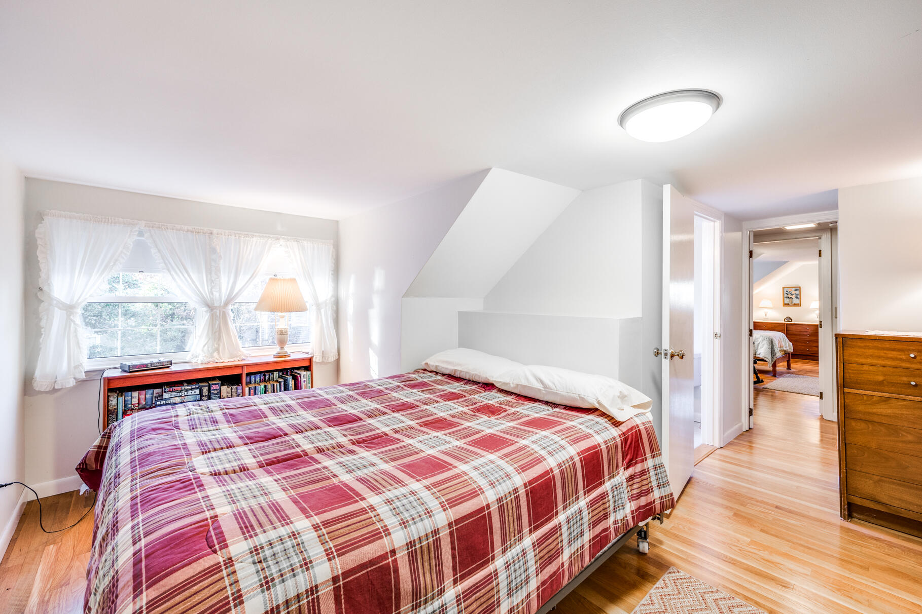 38 Rainbow Way Harwich, MA 02645 - Photo 38 of 50 a bedroom with a bed and wooden floor