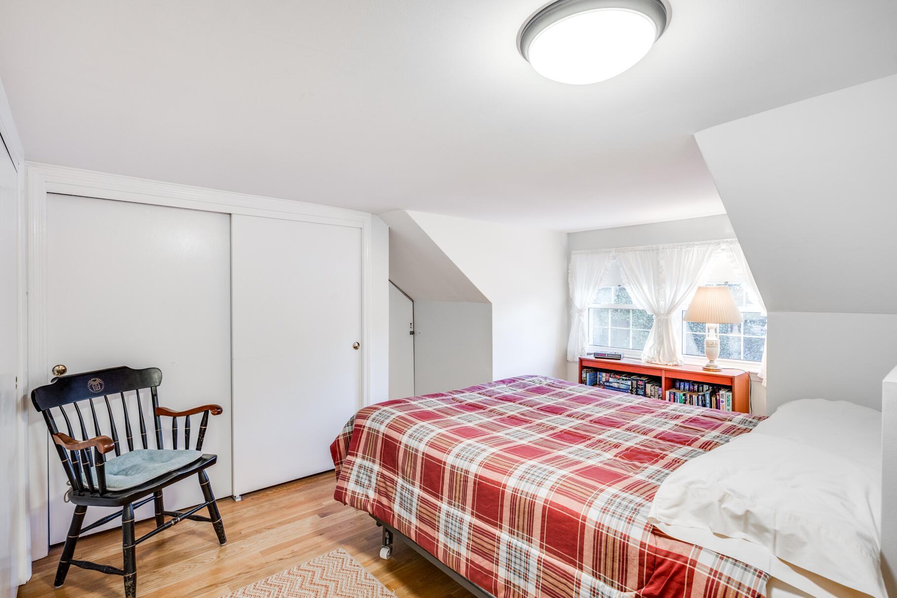 38 Rainbow Way Harwich, MA 02645 - Photo 39 of 50 a bedroom with a bed and chair