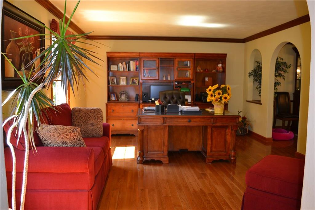 5808 Claridge Road Murrysville, PA 15632 - Photo 2 of 25 Formal living room featuring hardwood floors and crown molding.