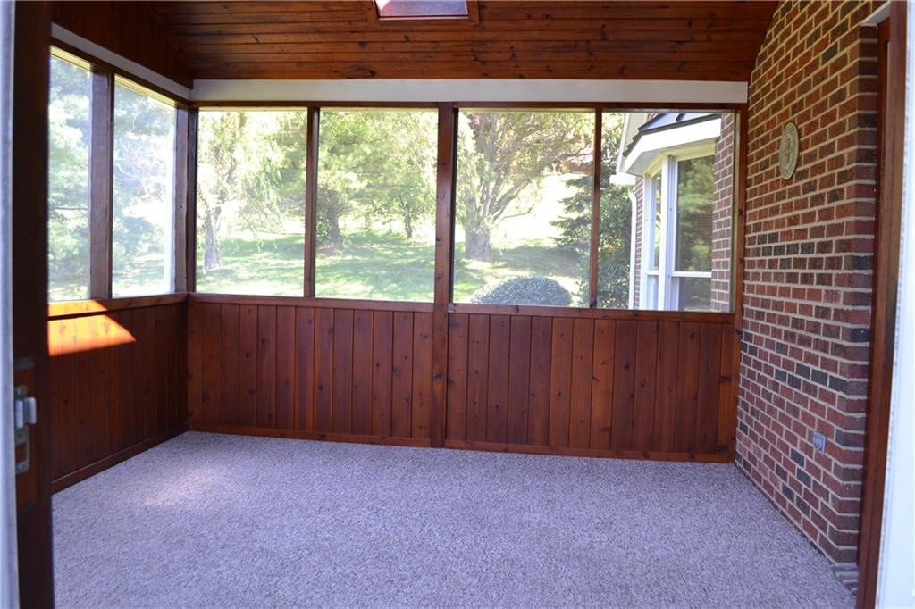 5808 Claridge Road Murrysville, PA 15632 - Photo 21 of 25 Covered porch featuring cathedral ceiling and skylights and access to open deck.