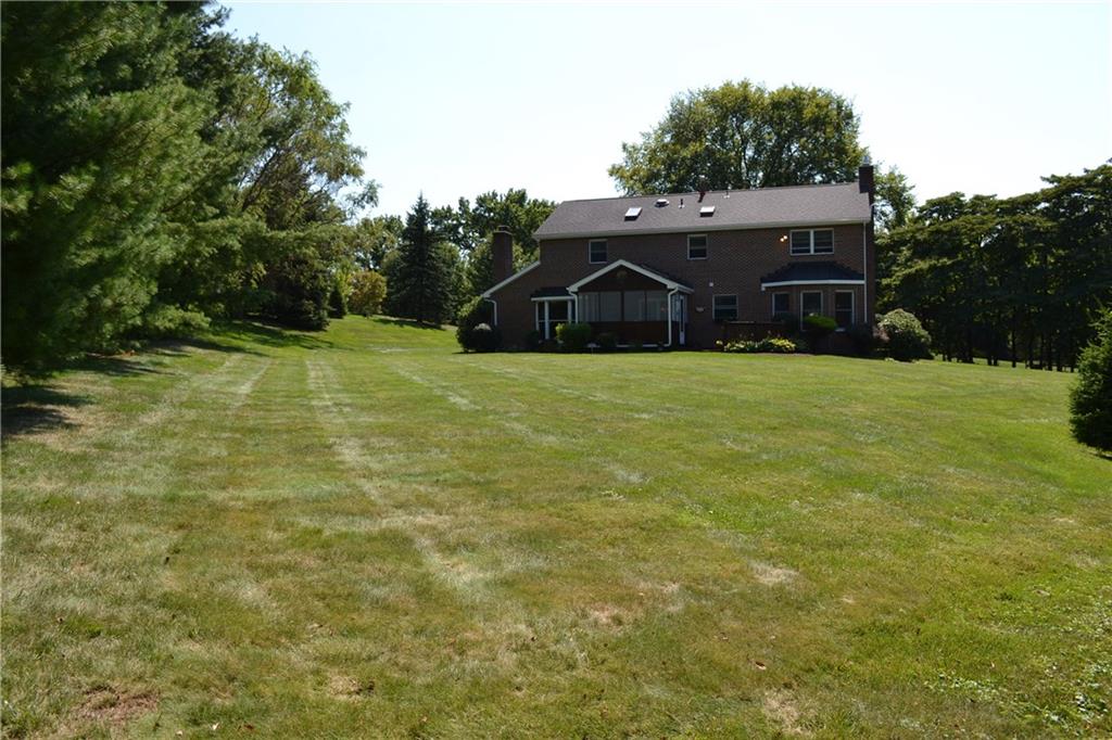 5808 Claridge Road Murrysville, PA 15632 - Photo 22 of 25 Level backyard, rear of yard lined with evergreens for year round privacy.