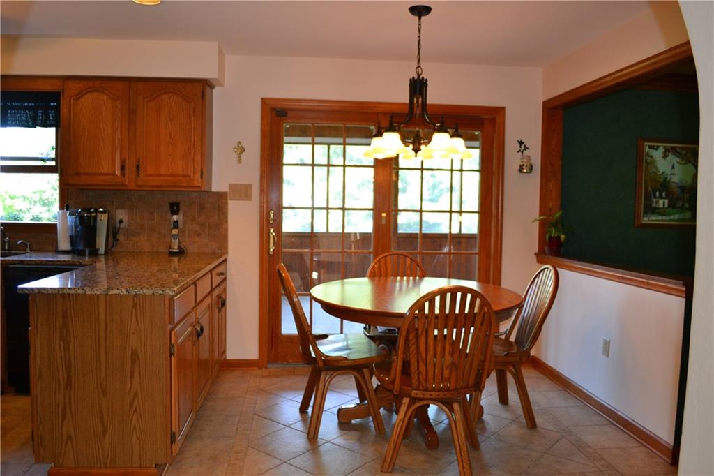 5808 Claridge Road Murrysville, PA 15632 - Photo 4 of 25 Breakfast area open to family room featuring ceramic flooring and sliding french door to covered patio.