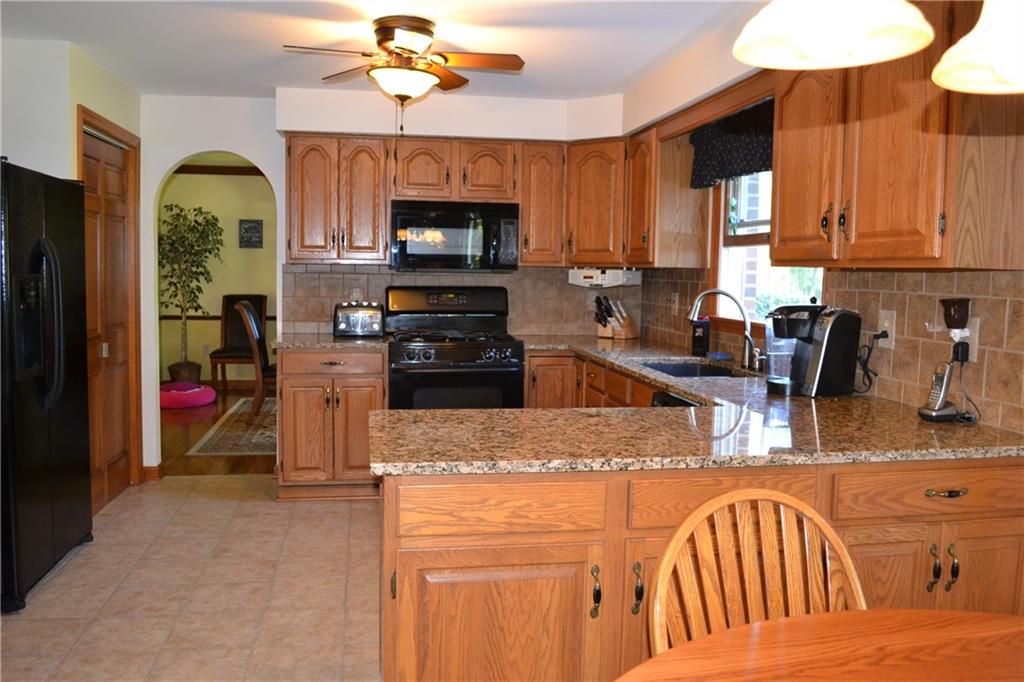 5808 Claridge Road Murrysville, PA 15632 - Photo 5 of 25 Fully equipped kitchen with oak cabinets, granite counters, ceramic back splash, pantry and desk area.