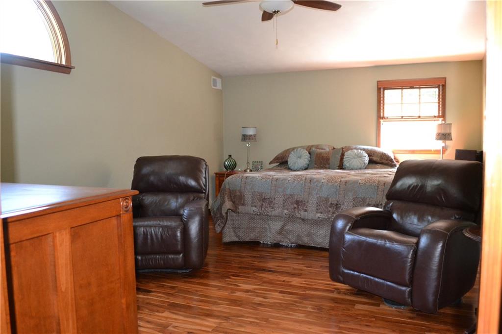 5808 Claridge Road Murrysville, PA 15632 - Photo 8 of 25 Master suite features hardwood flooring, vaulted ceiling, ceiling fan and crescent window.