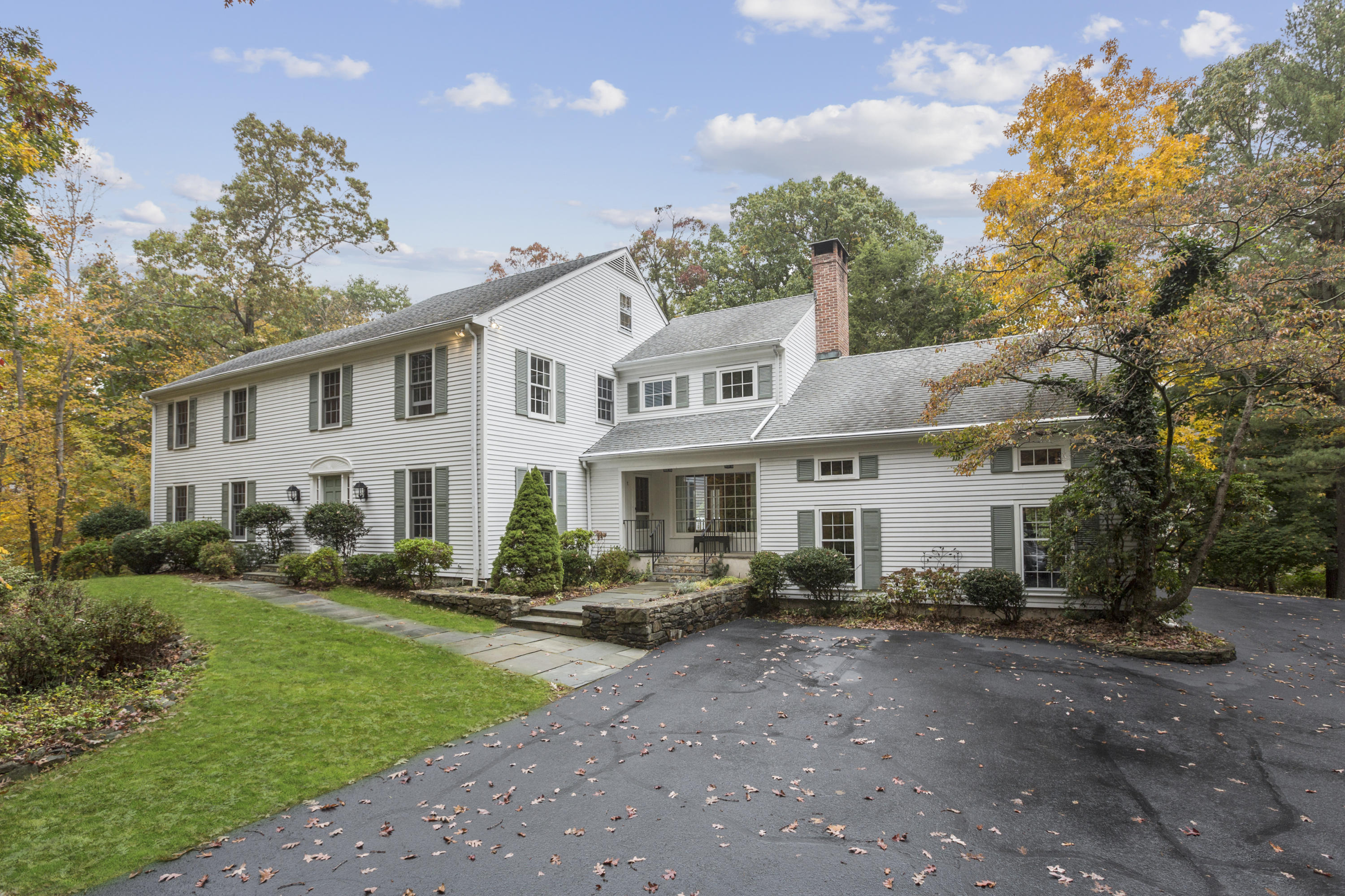 75 Delafield Island Road Darien, CT 06820 - Photo 1 of 28 a front view of a house with garden