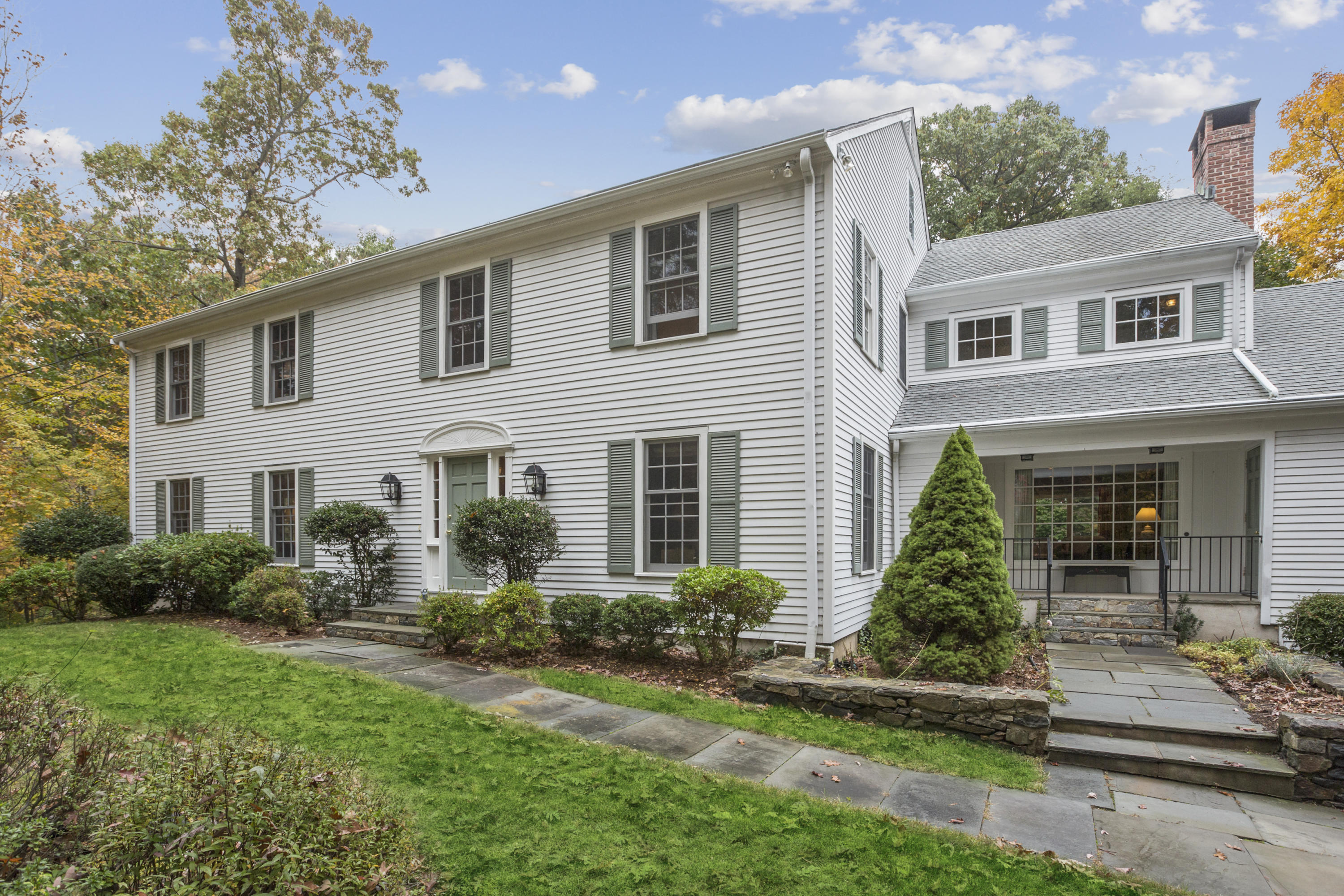 75 Delafield Island Road Darien, CT 06820 - Photo 2 of 28 a front view of a house with a yard