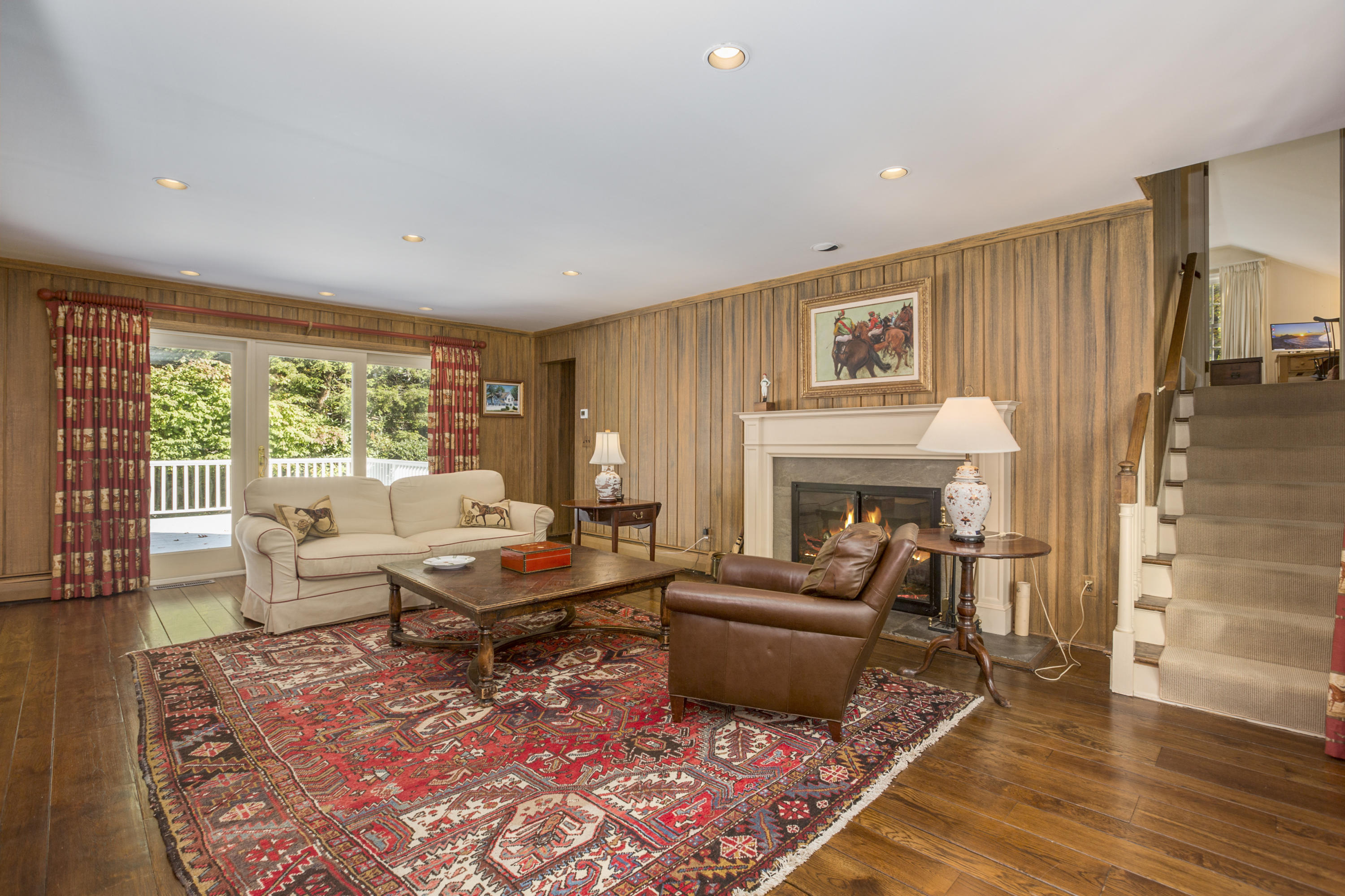 75 Delafield Island Road Darien, CT 06820 - Photo 11 of 28 a living room with furniture large window and a fireplace