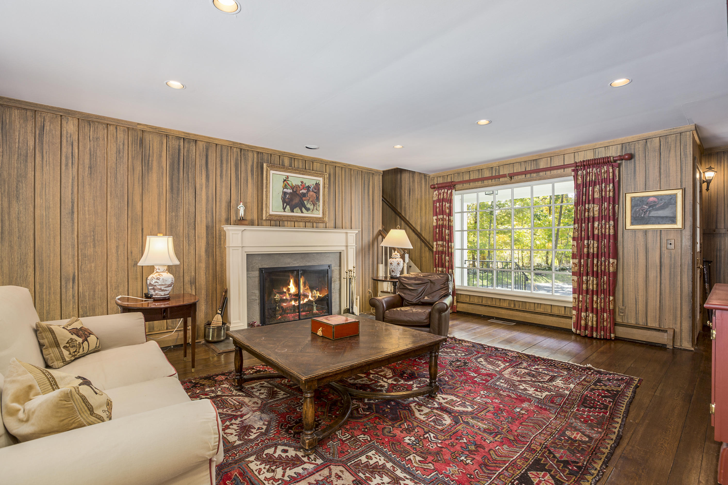 75 Delafield Island Road Darien, CT 06820 - Photo 12 of 28 a living room with furniture a rug and a fireplace