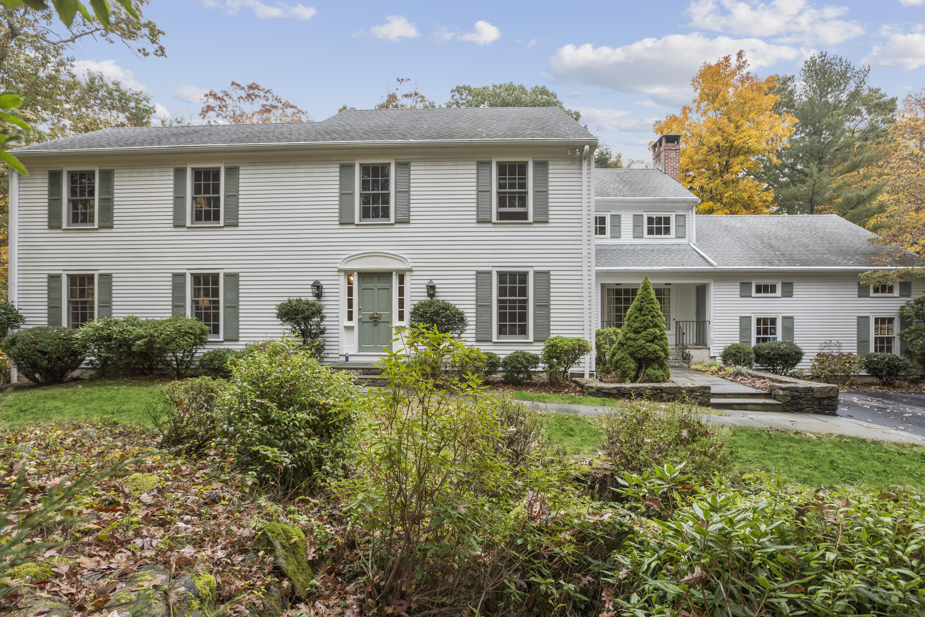 75 Delafield Island Road Darien, CT 06820 - Photo 3 of 28 a front view of a house with garden