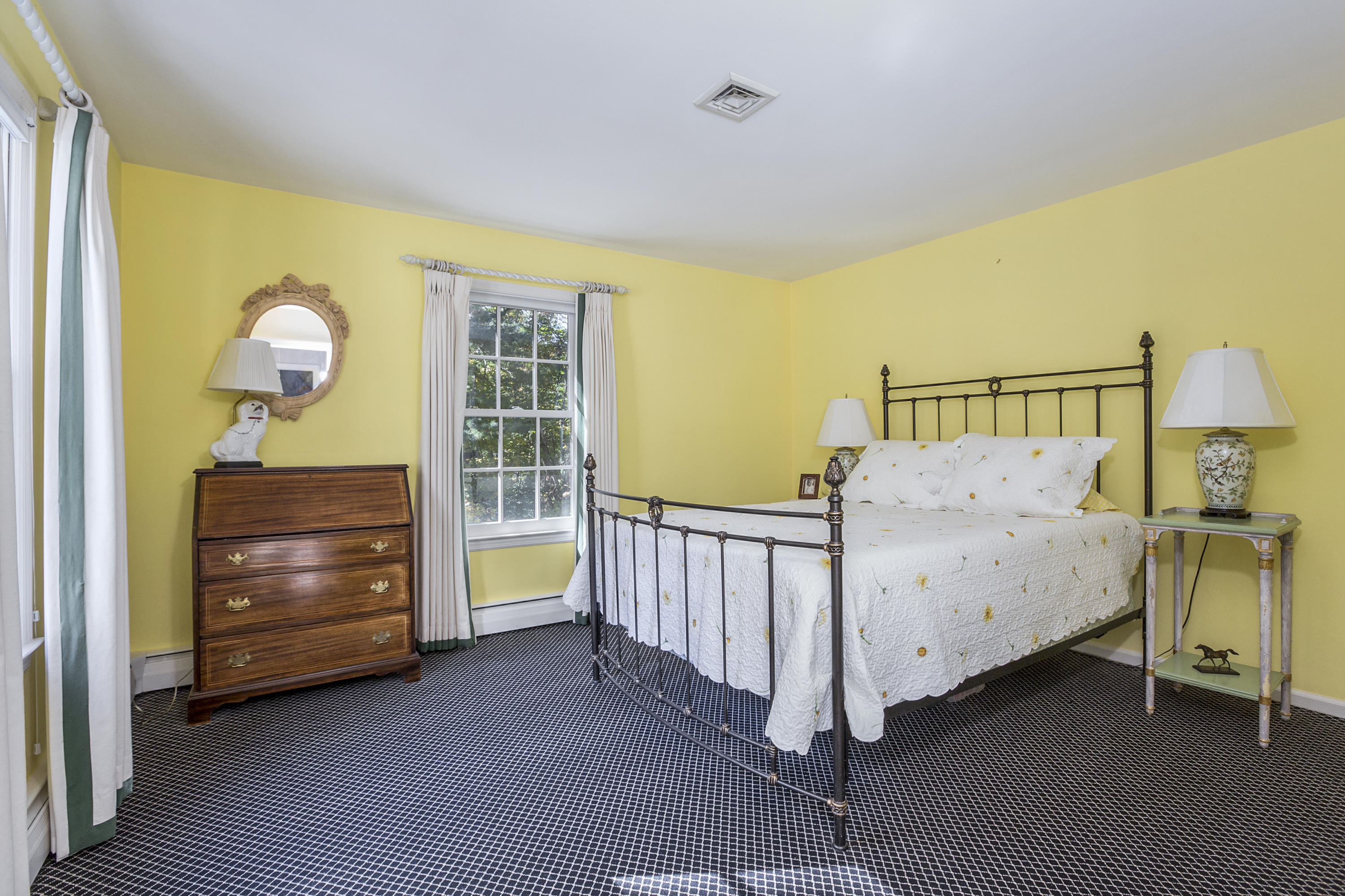75 Delafield Island Road Darien, CT 06820 - Photo 21 of 28 a bedroom with a bed and a window