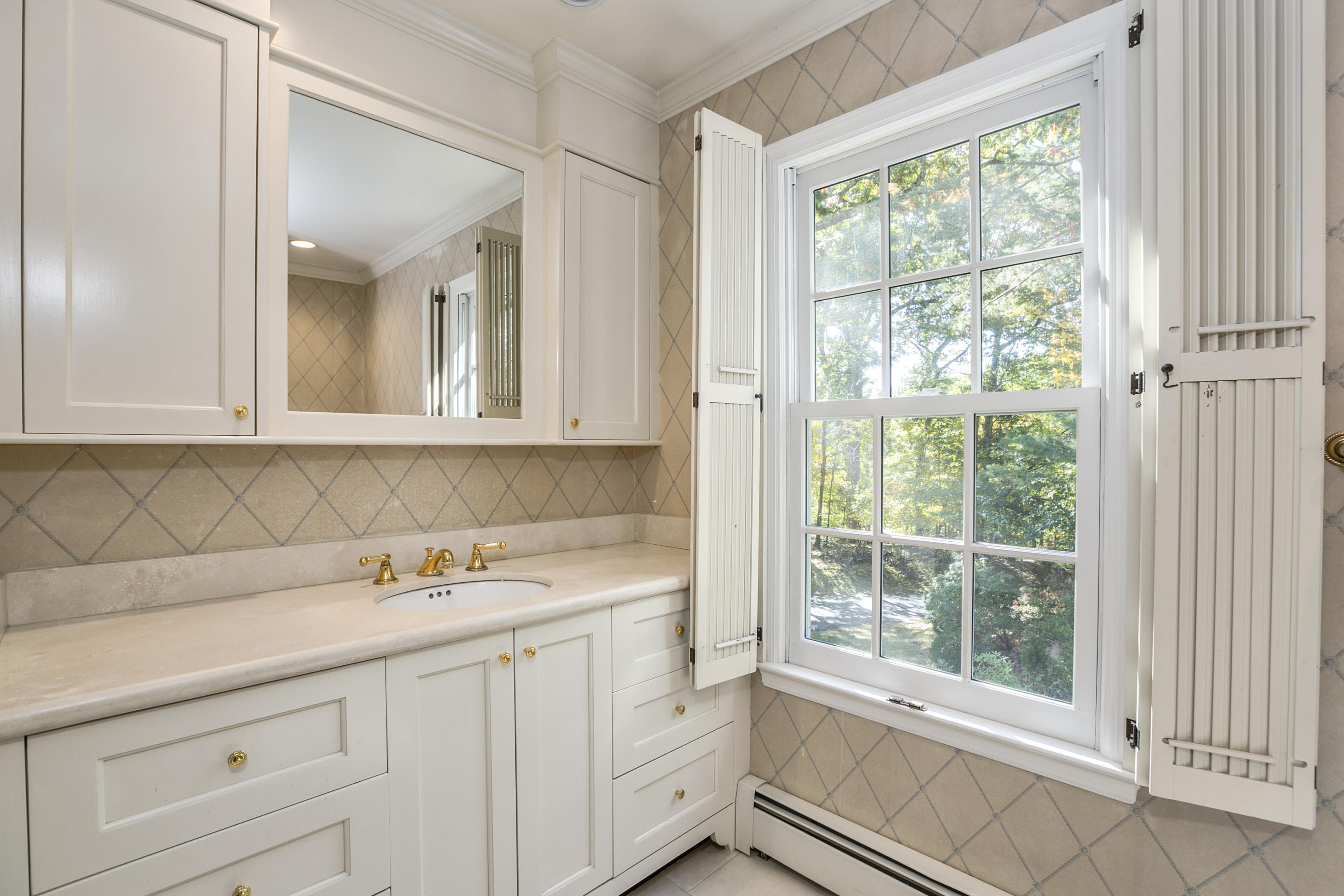 75 Delafield Island Road Darien, CT 06820 - Photo 23 of 28 a view of cabinets a sink and a window in a white room